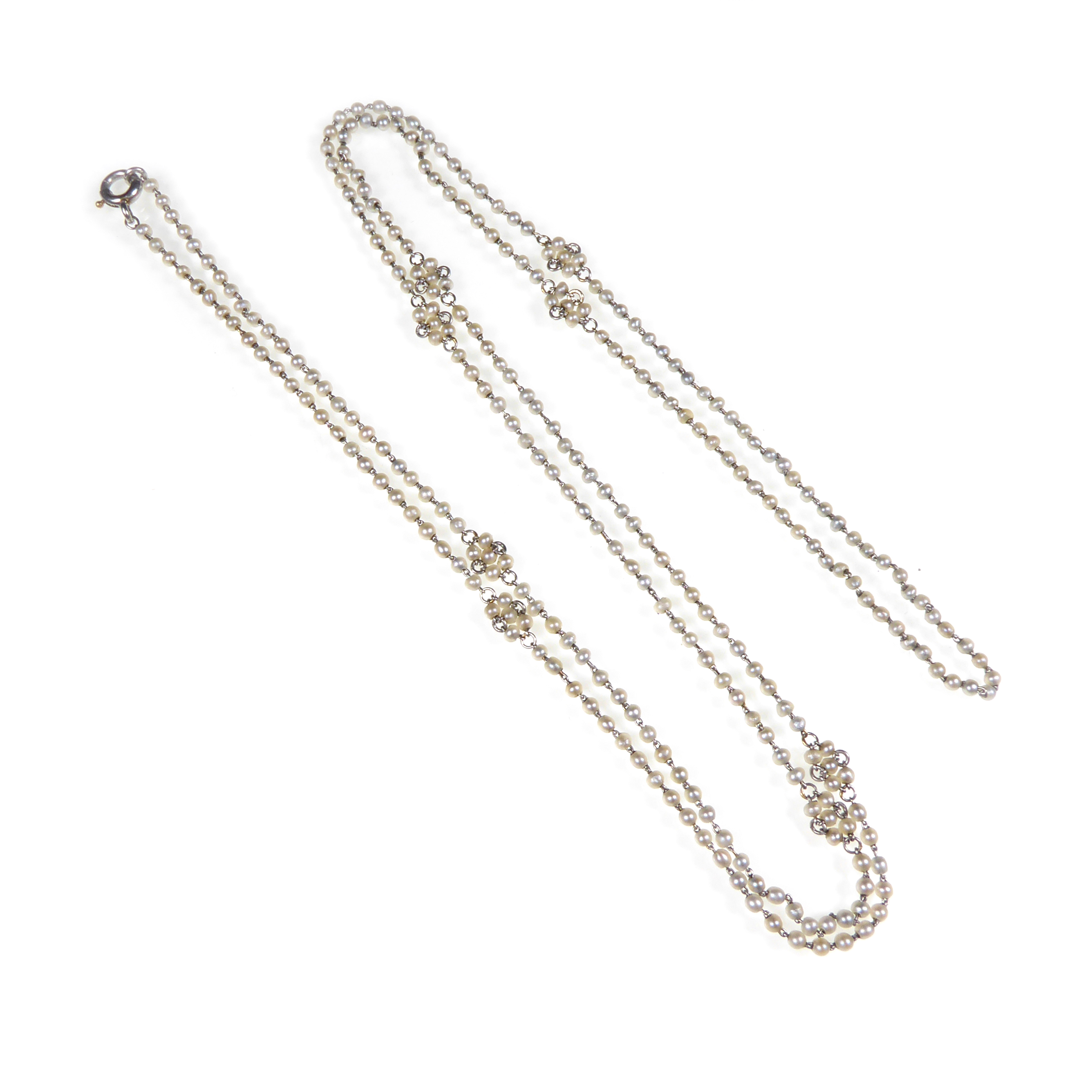 Early 20th century seed pearl chain necklace, c.1910, spaced by florette clusters,